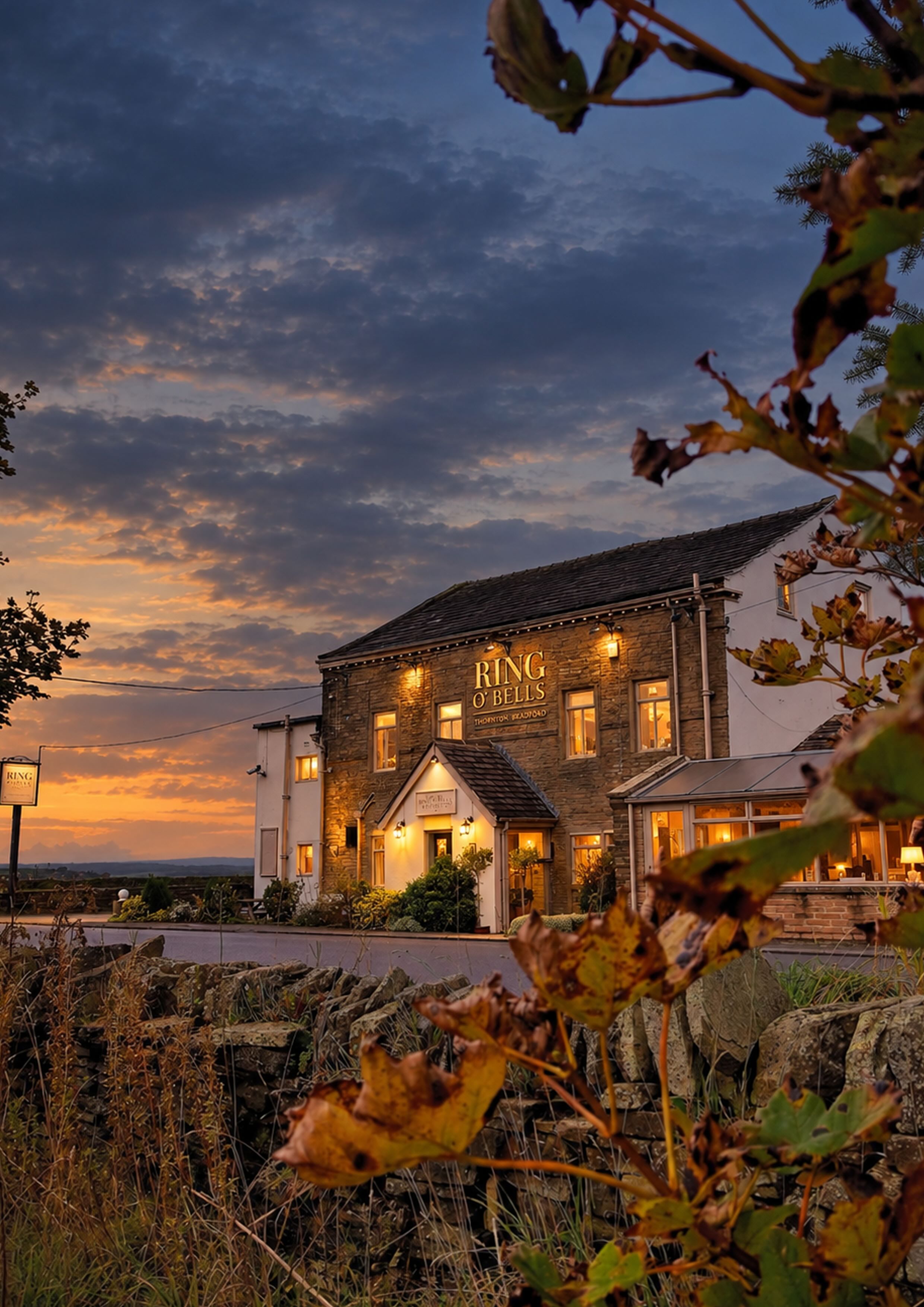 The Ring O' Bells Inn illuminated after sunset